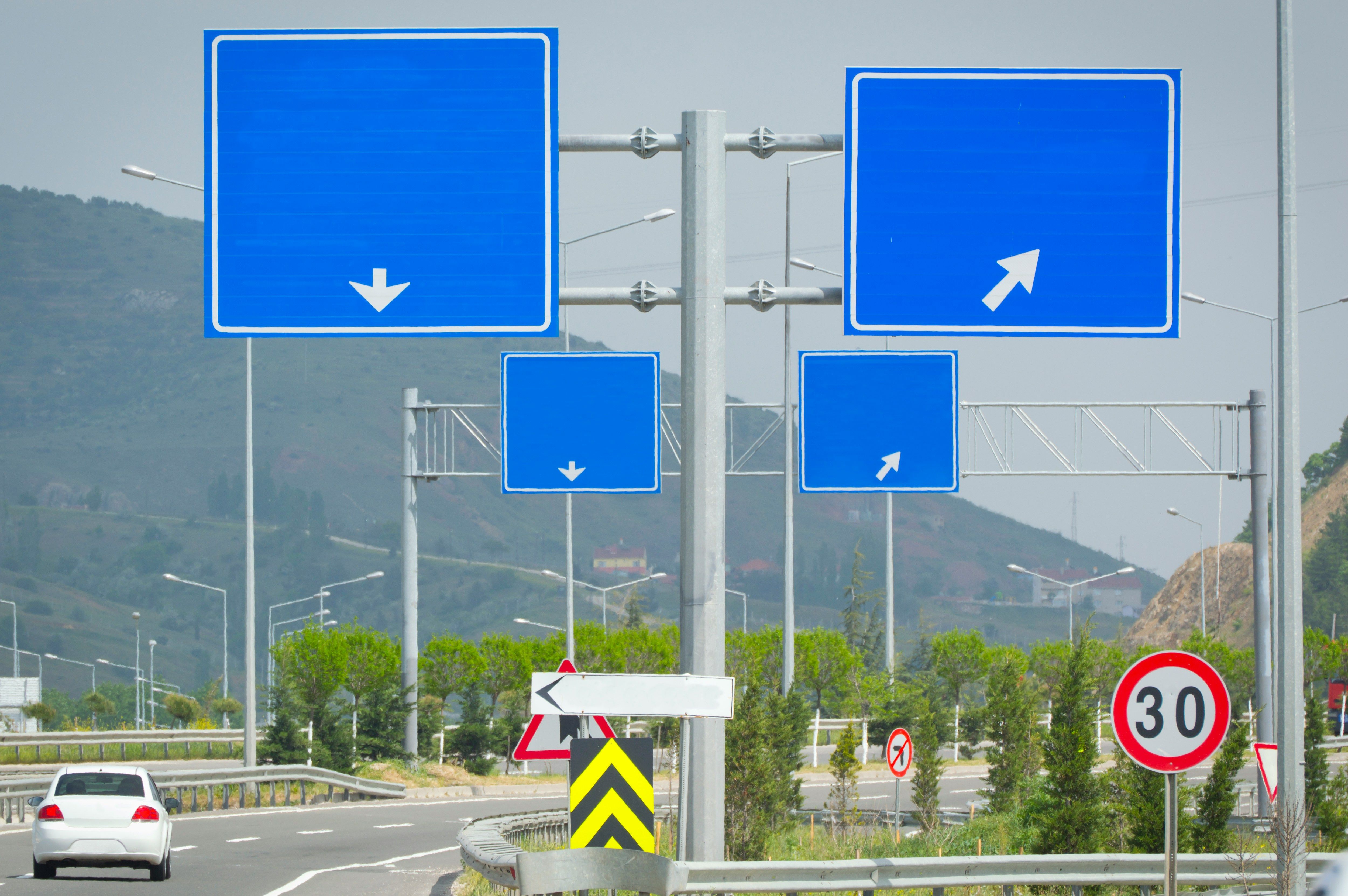 Multiple directional road signs pointing different ways
