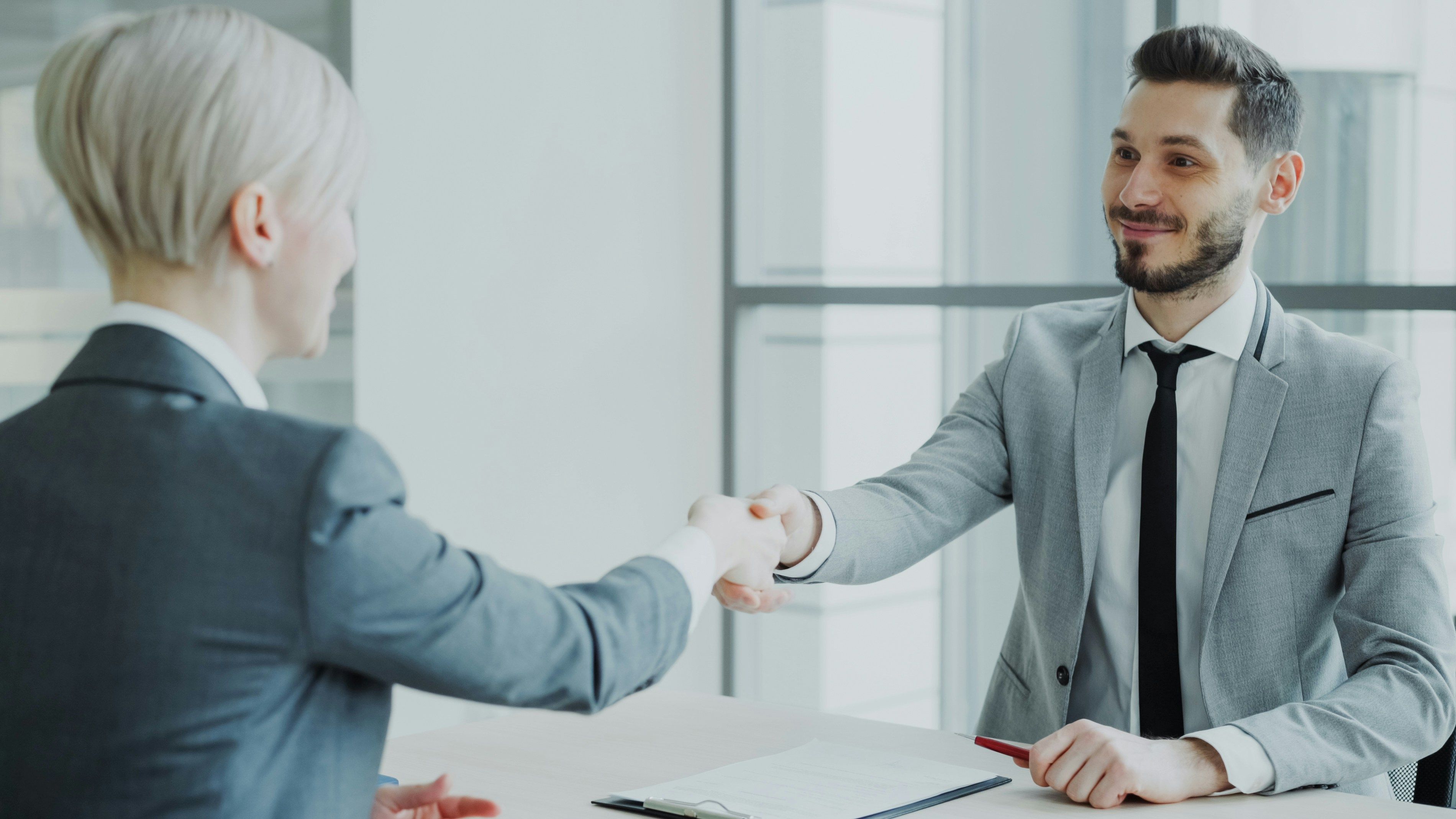 Business handshake authorizing a broker