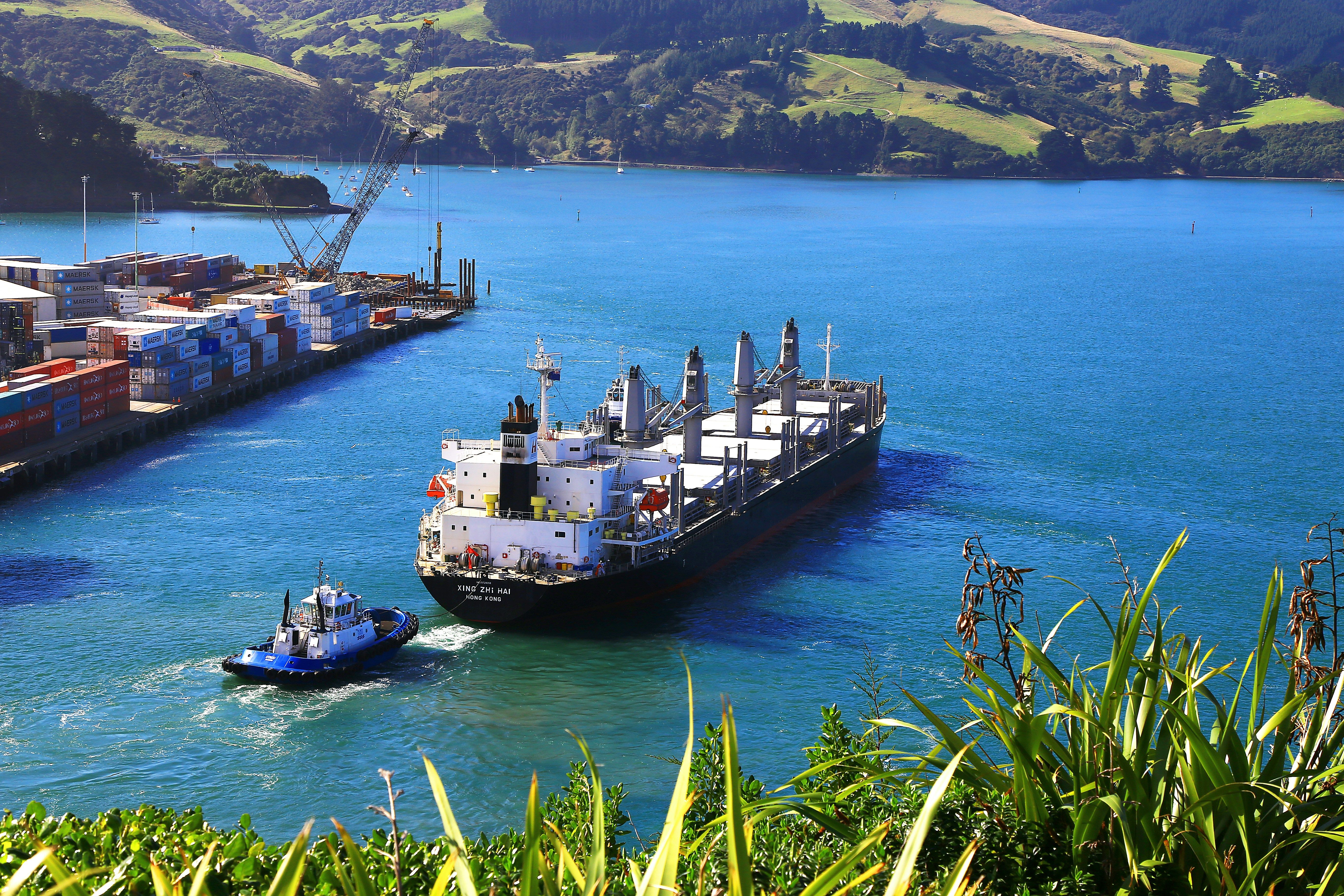 Container ship departing port representing duty drawback on exports