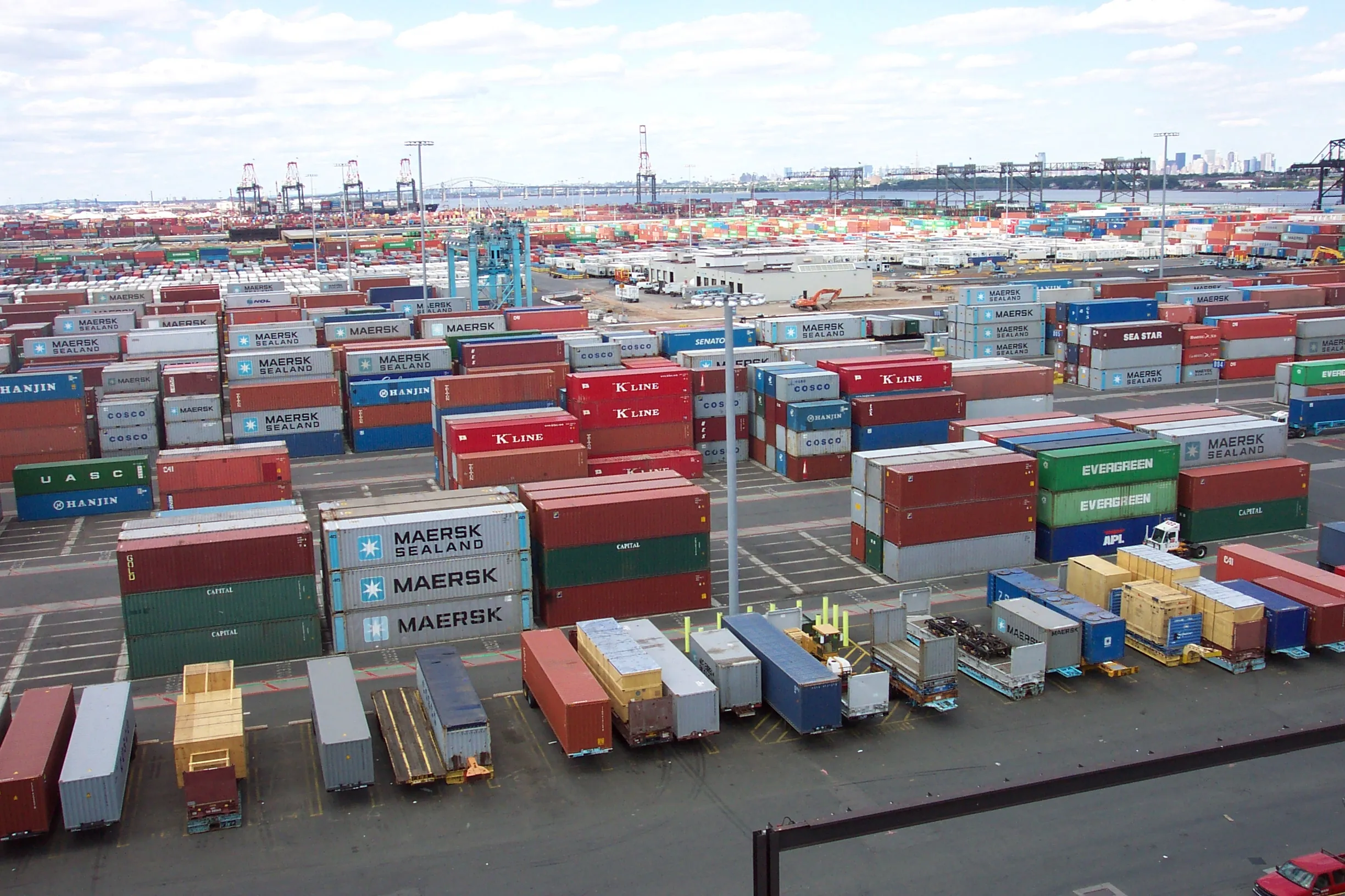 Thousands of shipping containers stacked at the Port Newark–Elizabeth Marine Terminal in New Jersey—one of the largest U.S. container ports affected by IEEPA tariffs.