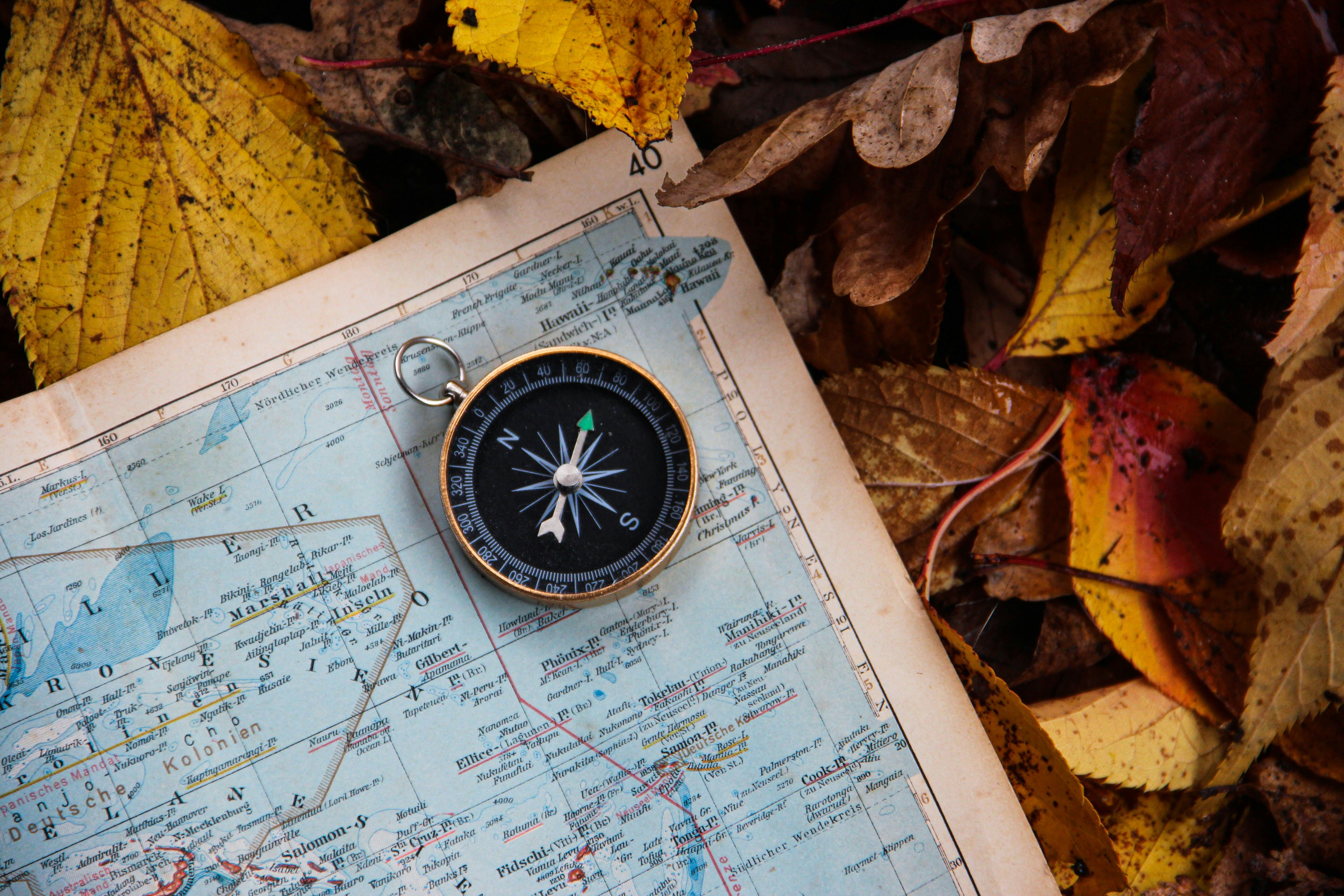 Compass and map representing planning a route through the CAPE Phase 2 unknown