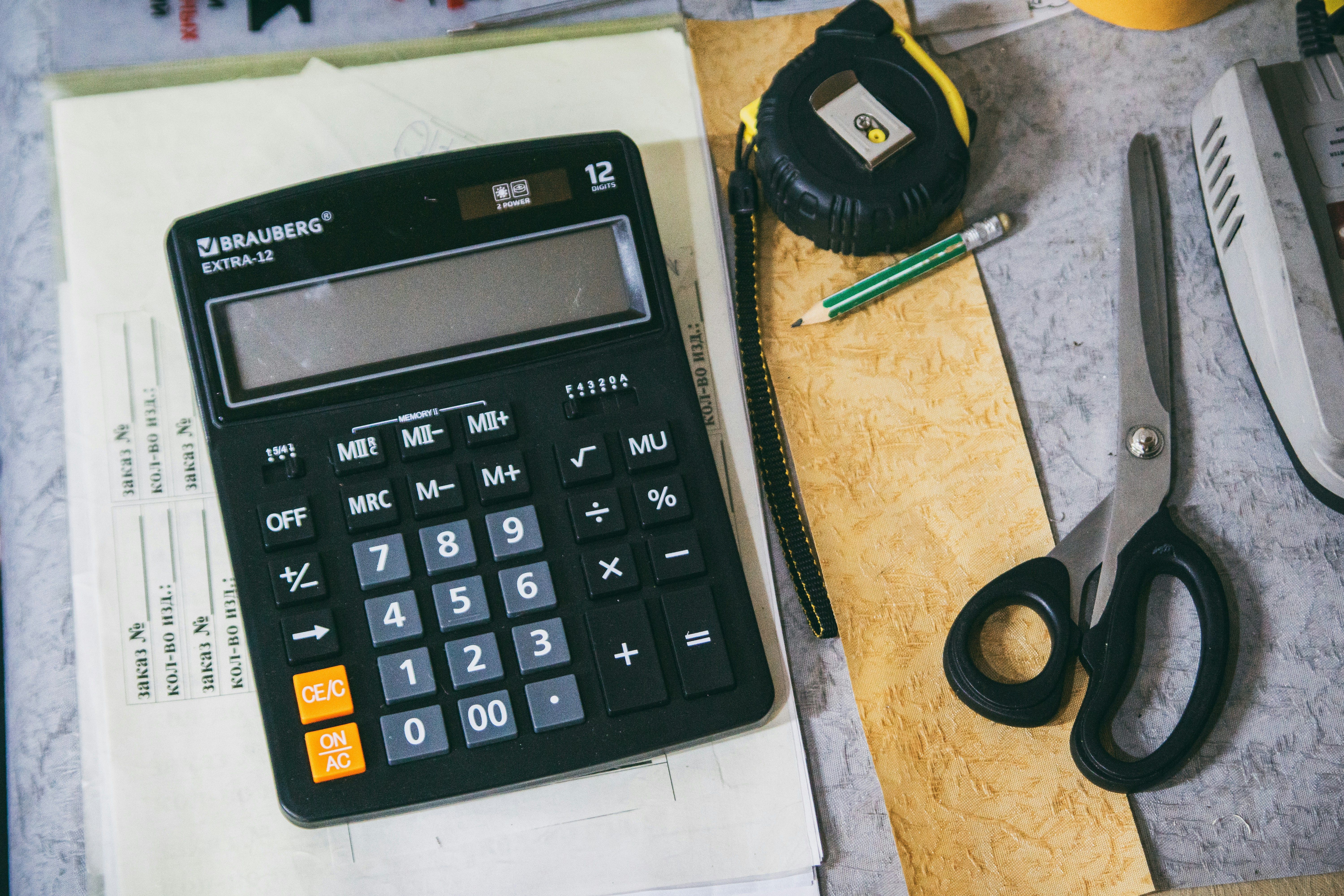 Calculator and paperwork on a desk